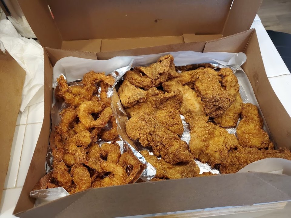 Seafood menu listing fried and grilled options.