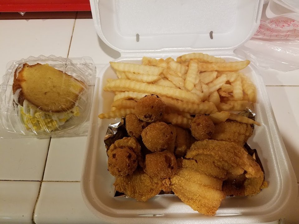 Seafood menu listing fried and grilled options.